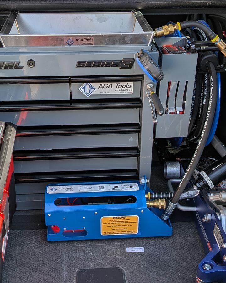 Drain pan on top of the tool chest, next to the hose reel and the remote pump.