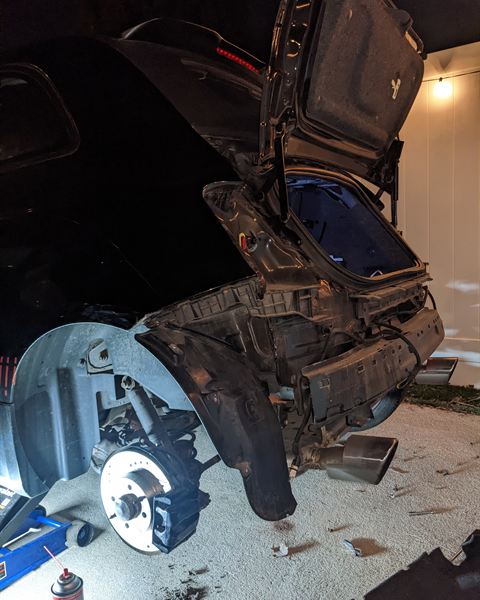 Rear of a car taken apart during a flood restoration.