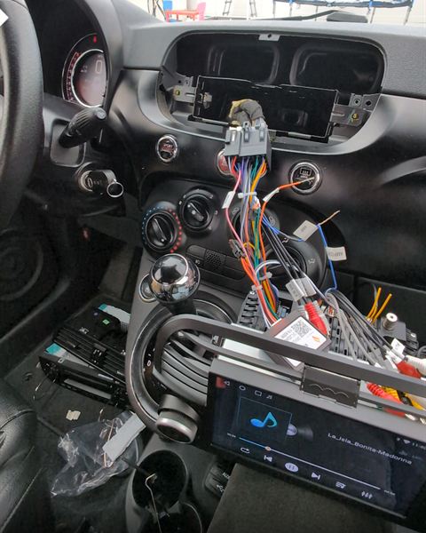 Dashboard opened up with the wiring for a new touchscreen radio.