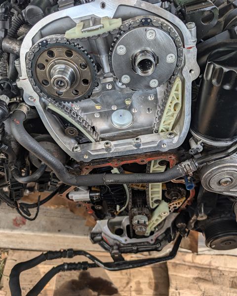 Engine with the timing cover off, showing the timing chain and gears.